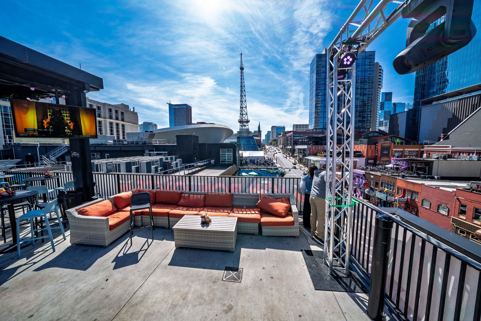 A rooftop view down Lower Broadway in downtown Nashville on a bright day.